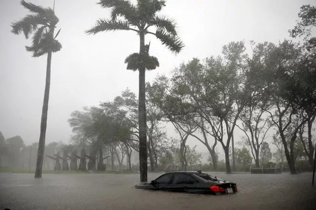 a partially submerged car is seen at a flooded area in coconut grove as hurricane irma arrives at south florida in miami florida us photo reuters a partially submerged car is seen at a flooded area in coconut grove as hurricane irma arrives at south florida in miami florida us photo reuters