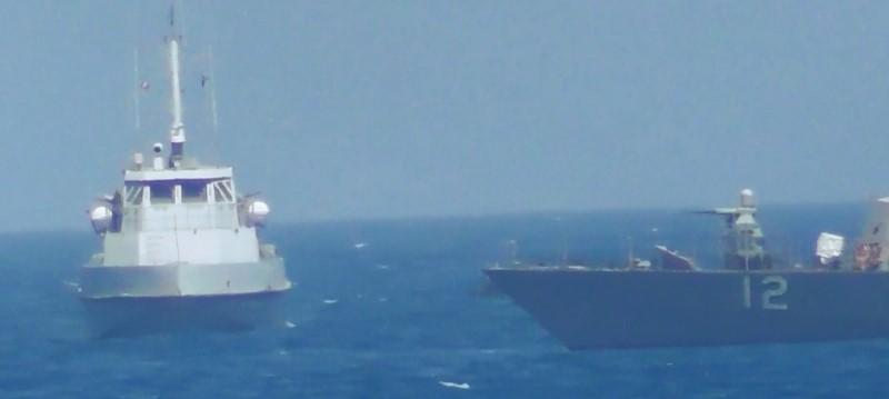 an iranian vessel steers close to the u s navy coastal patrol craft uss thunderbolt r in the gulf in a still image from video provided by the u s navy photo reuters