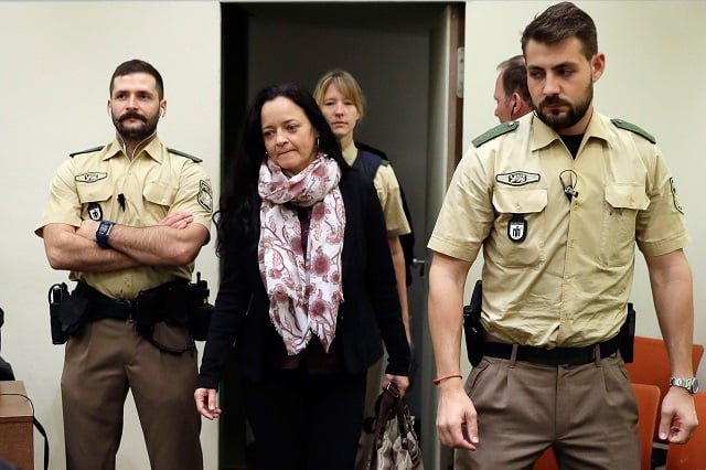 defendant beate zschaepe 2nd l arrives at a courtroom on september 12 2017 in munich southern germany german prosecutors sought life in jail for the surviving member of a german neo nazi trio accused of a string of racist murders that targeted mostly turkish immigrants beate zschaepe is co accused in the 10 killings carried out by the other two members of the self styled national socialist underground nsu uwe mundlos and uwe boehnhardt between 2000 and 2007 photo afp