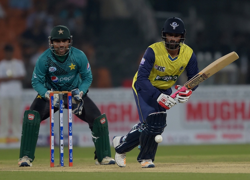 world xi batsman tamim iqbal r plays a shot as pakistani captain and wicketkeeper sarfraz ahmad looks on during the first twenty20 international match between the world xi and pakistan at the gaddafi cricket stadium in lahore on september 12 2017 photo afp