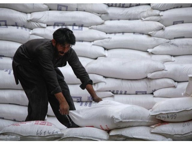 a laborer unloads sacks of sugar from a supply truck at the main wholesale market in karachi february 19 2012 photo reuters