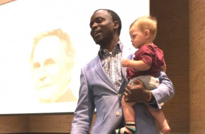 professor gives lecture while holding student s baby