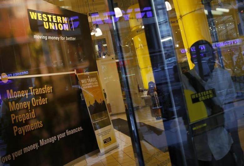 a person walks out of a western union branch in new york photo reuters