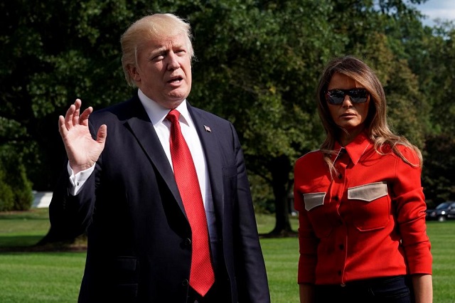 us president donald trump talks to the media about hurricane irma next to first lady melania trump on the south lawn of the white house upon their return to washington us from camp david september 10 2017 photo reuters yuri gripas