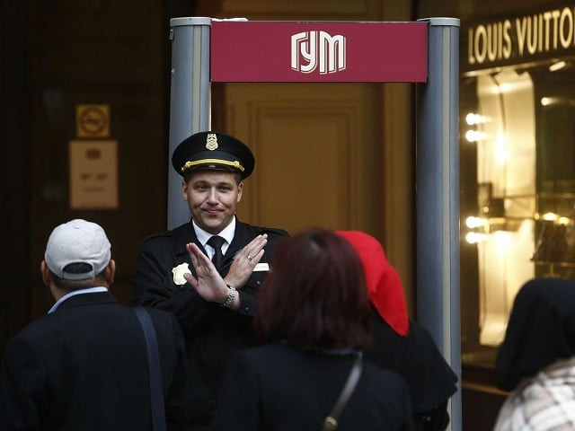 a security guard blocks the entrance to the state department store gum due to a bomb threat in central moscow photo reuters a security guard blocks the entrance to the state department store gum due to a bomb threat in central moscow photo reuters