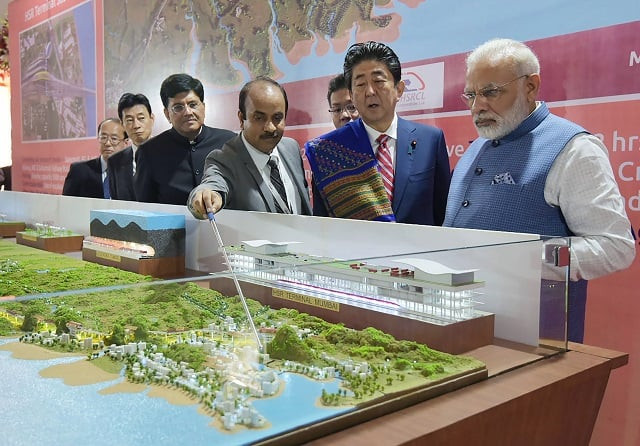 this handout photograph released by india 039 s press information bureau pib on september 14 2017 shows indian prime minister narendra modi l and japanese prime minister shinzo abe looking at a railway station model at a ground breaking ceremony for the mumbai ahmedabad high speed rail project in ahmedabad india 039 s first bullet train project a 19 billion initiative linking ahmedabad to mumbai was launched september 14 as indian prime minister narendra modi and japanese counterpart shinzo abe hailed fast growing ties between asia 039 s two biggest democracies photo afp this handout photograph released by india 039 s press information bureau pib on september 14 2017 shows indian prime minister narendra modi l and japanese prime minister shinzo abe looking at a railway station model at a ground breaking ceremony for the mumbai ahmedabad high speed rail project in ahmedabad india 039 s first bullet train project a 19 billion initiative linking ahmedabad to mumbai was launched september 14 as indian prime minister narendra modi and japanese counterpart shinzo abe hailed fast growing ties between asia 039 s two biggest democracies photo afp