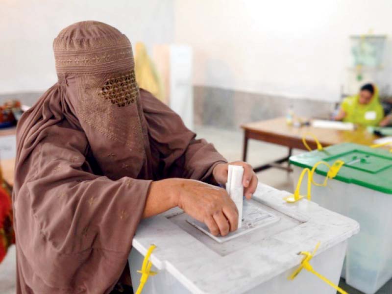a woman casts her vote in peshawar women are barred by the local people however to go to polling stations in the tribal areas photo file