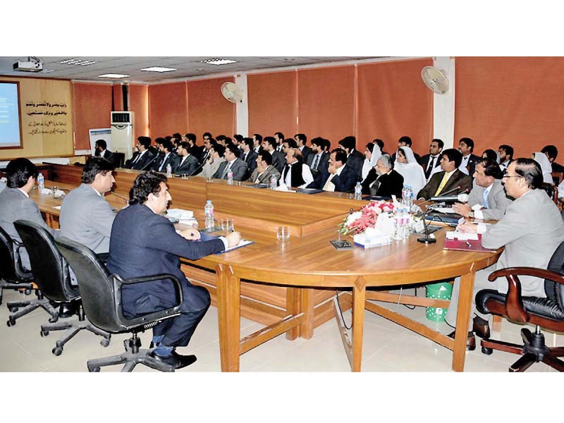 nab chairman qamar zaman chaudhry addresses nab officers during his farewell visit to nab k p in peshawar photo nni