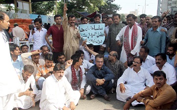 carrying banners and placards inscribed with slogans against the sindh government qat workers said five girls have been murdered in the last week in the province photo online