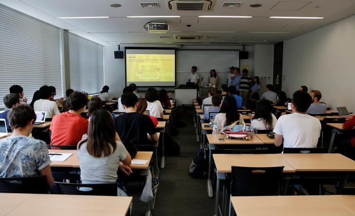 students attend a class at a university photo reuters