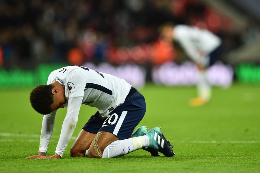 tottenham hotspur 039 s english midfielder dele alli sinks to his knees at the final whistle in the english premier league football match between tottenham hotspur and swansea city at wembley stadium in london on september 16 2017 photo afp