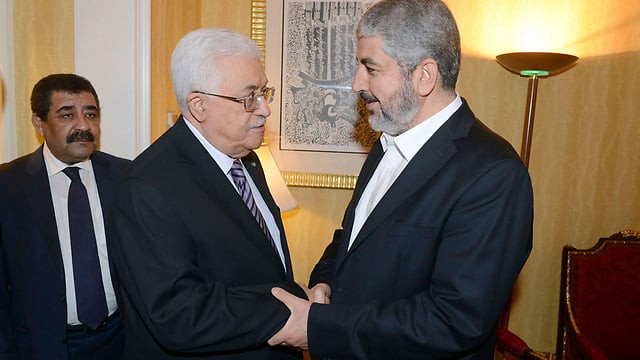 fatah leader and pa president abbas with hamas leader mashal in doha photo reuters fatah leader and pa president abbas with hamas leader mashal in doha photo reuters