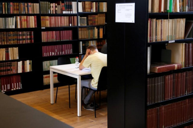 a student sits in a library photo reuters a student sits in a library photo reuters