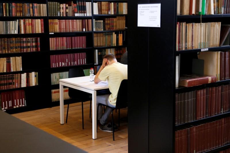 a student sits in a library photo reuters