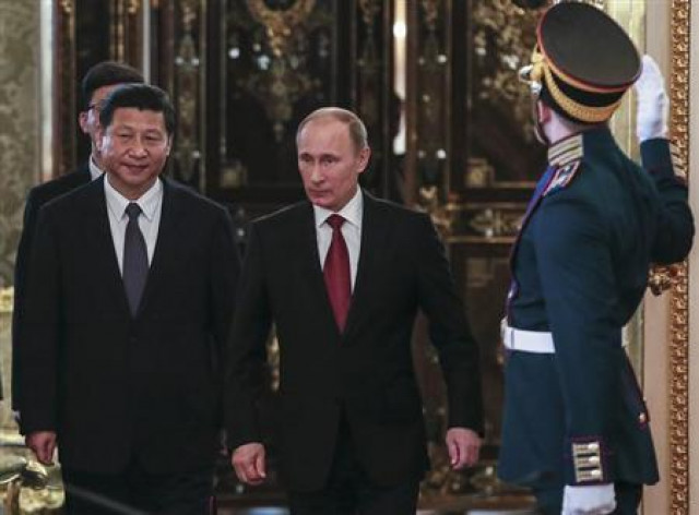 russia 039 s president vladimir putin c and his chinese counterpart xi jinping walk into a hall as they meet at the kremlin in moscow photo reuters russia 039 s president vladimir putin c and his chinese counterpart xi jinping walk into a hall as they meet at the kremlin in moscow photo reuters