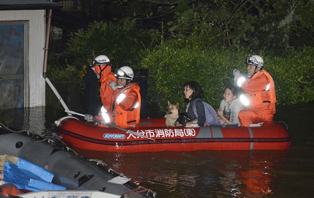 local residents are evacuated by boat from an inundated house due to a heavy rain triggered by typhoon talim in oita southern japan in this photo taken by kyodo september 17 2017 photo reuters