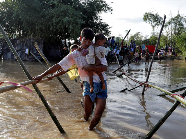 rohingya cross a swollen river at a refugee camp in cox 039 s bazar bangladesh september 17 2017 photo reuters