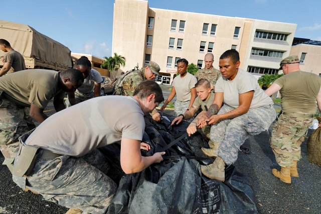 soldiers from the 602nd area support medical company secure a portable tent as they break down a field hospital outside the schneider regional medical center while preparing to evacuate their unit in advance of hurricane maria in charlotte amalie st thomas u s virgin islands september 17 2017 photo reuters jonathan drake