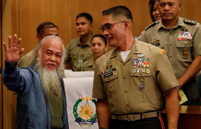 marawi 039 s vicar general father teresito quot chito quot soganub waves to the media and soldiers at a military camp after soldiers rescued him from the islamic state linked rebels stronghold in marawi during a news conference in quezon city metro manila philippines september 18 2017 photo reuters dondi tawatao