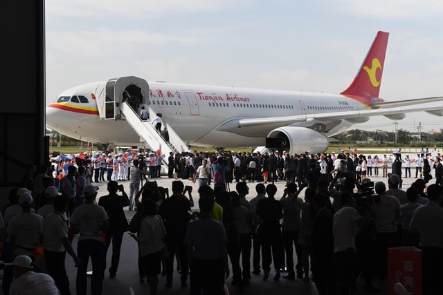 officials look at the first airbus a330 plane to be delivered during the inauguration ceremony of the airbus long range cabin completion centre in tianjin china on september 20 2017 photo afp officials look at the first airbus a330 plane to be delivered during the inauguration ceremony of the airbus long range cabin completion centre in tianjin china on september 20 2017 photo afp