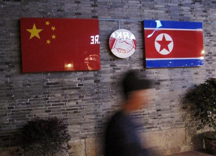 flags of china and north korea are seen outside the closed ryugyong korean restaurant in ningbo zhejiang province china photo reuters