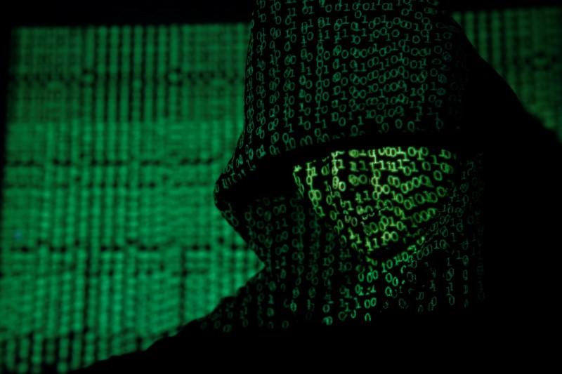 a projection of cyber code on a hooded man is pictured in this illustration picture taken on may 13 2017 photo reuters