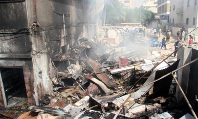one killed as building in karachi catches fire after explosion one killed as building in karachi catches fire after explosion