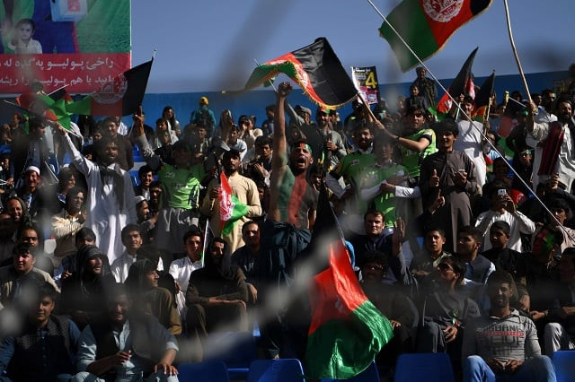 in this photograph taken on september 18 2017 afghan cricket fans cheer and wave the national flag during a match between kabul eagles and band e amir dragons during the shpageeza cricket league t20 tournament at the kabul international cricket ground in kabul thousands of cricket mad fans have been travelling across the war torn country to watch the domestic t20 competition photo afp in this photograph taken on september 18 2017 afghan cricket fans cheer and wave the national flag during a match between kabul eagles and band e amir dragons during the shpageeza cricket league t20 tournament at the kabul international cricket ground in kabul thousands of cricket mad fans have been travelling across the war torn country to watch the domestic t20 competition photo afp