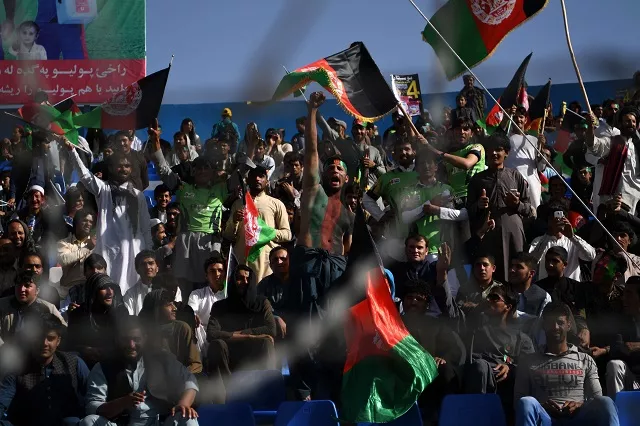 in this photograph taken on september 18 2017 afghan cricket fans cheer and wave the national flag during a match between kabul eagles and band e amir dragons during the shpageeza cricket league t20 tournament at the kabul international cricket ground in kabul thousands of cricket mad fans have been travelling across the war torn country to watch the domestic t20 competition photo afp in this photograph taken on september 18 2017 afghan cricket fans cheer and wave the national flag during a match between kabul eagles and band e amir dragons during the shpageeza cricket league t20 tournament at the kabul international cricket ground in kabul thousands of cricket mad fans have been travelling across the war torn country to watch the domestic t20 competition photo afp