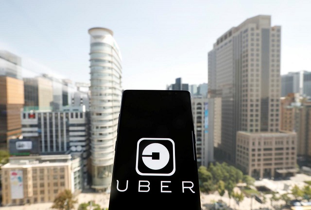 a photo illustration shows the uber app logo displayed on a mobile phone in seoul south korea september 21 2017 photo reuters