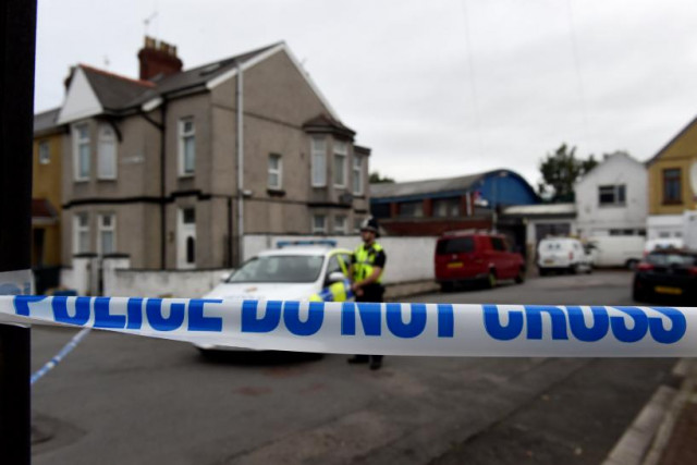 a police officer stands behind cordon tape after a man was arrested in connection with an explosion on the london underground in newport wales britain september 20 2017 photo reuters