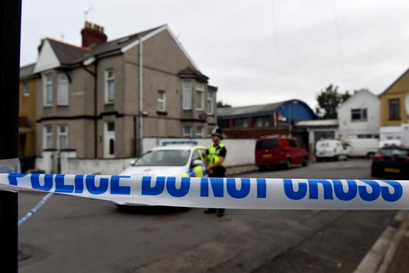 a police officer stands behind cordon tape after a man was arrested in connection with an explosion on the london underground in newport wales britain september 20 2017 photo reuters