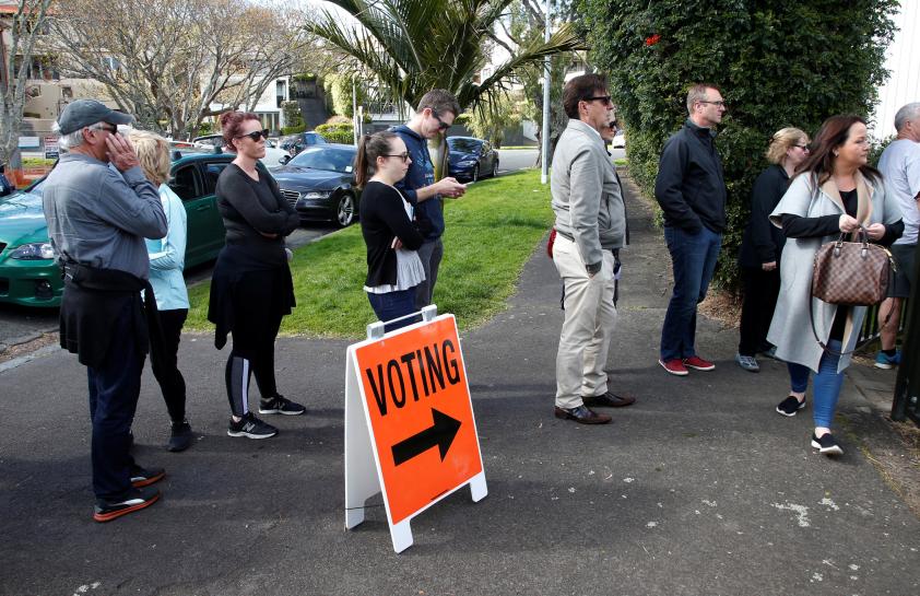 voters wait outside a polling station at the st heliers tennis club during the general election in auckland new zealand september 23 2017 photo reuters