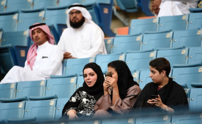 in a first women throng saudi stadium for national day