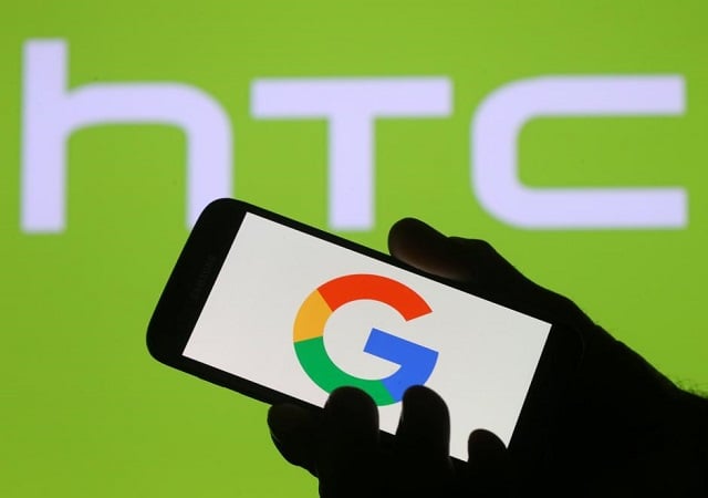 the google logo is seen on a smartphone in front of a displayed htc logo in this illustration taken september 21 2017 photo reuters