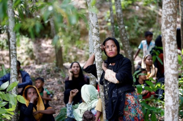 rohingya woman looks on after being restricted by the members of border guards bangladesh bgb to enter into bangladesh side in cox s bazar banglades photo reuters rohingya woman looks on after being restricted by the members of border guards bangladesh bgb to enter into bangladesh side in cox s bazar banglades photo reuters