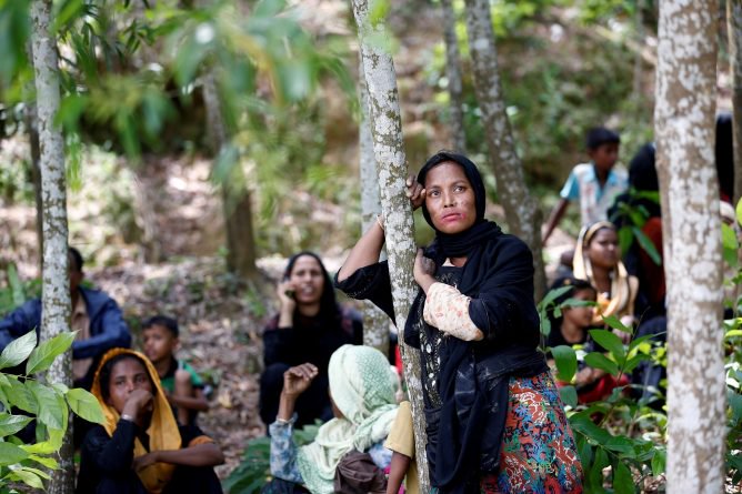 rohingya woman looks on after being restricted by the members of border guards bangladesh bgb to enter into bangladesh side in cox s bazar banglades photo reuters