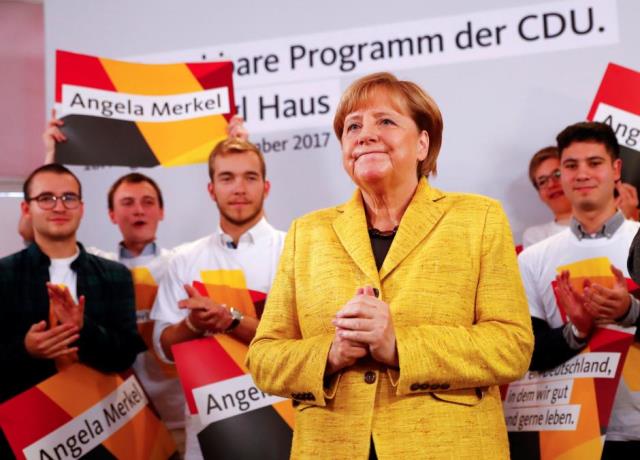 german chancellor angela merkel attends a breakfast with supporters at the christian democratic union cdu party election campaign meeting centre in berlin photo reuters