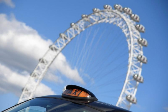 a taxi drives past the london eye in central london britain september 22 2017 photo reuters a taxi drives past the london eye in central london britain september 22 2017 photo reuters