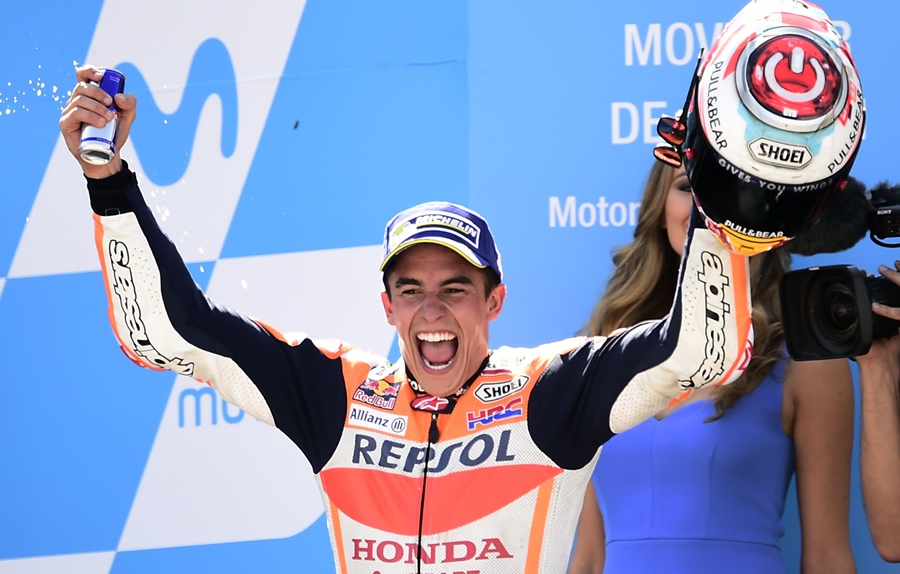 repsol honda team 039 s spanish rider marc marquez celebrates on the podium winning the moto gp race of the moto grand prix of aragon at the motorland circuit in alcaniz on september 24 2017 photo afp