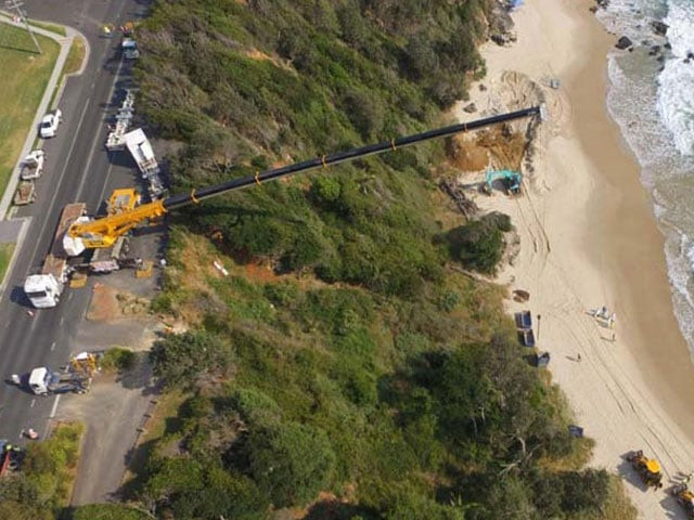the 18 tonne animal came ashore entangled in fishing ropes last week at nobbys beach photo afp the 18 tonne animal came ashore entangled in fishing ropes last week at nobbys beach photo afp