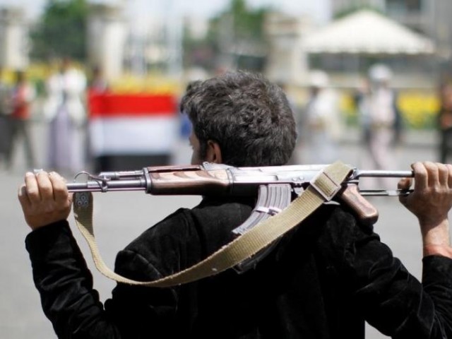 an armed man loyal to the houthi movement holds his weapon as he gathers to protest against the saudi backed exiled government deciding to cut off the yemeni central bank from the outside world in the capital sanaa yemen photo reuters