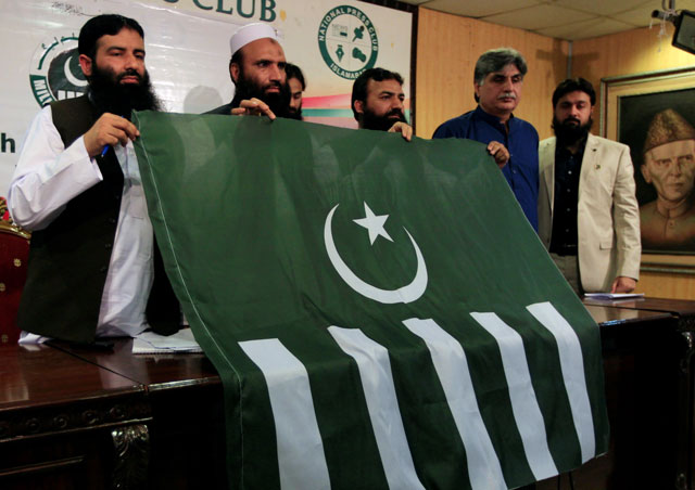 saifullah khalid 2nd l president of milli muslim league mml political party holds a party flag with others during a news conference in islamabad on august 7 2017 photo reuters file