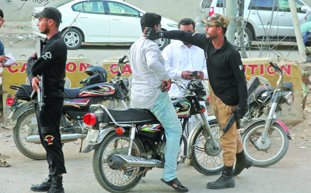 maintaining peace since the start of muharram police and security forces have been extra vigilant in performing checks on the roads and streets of karachi photo athar khan express