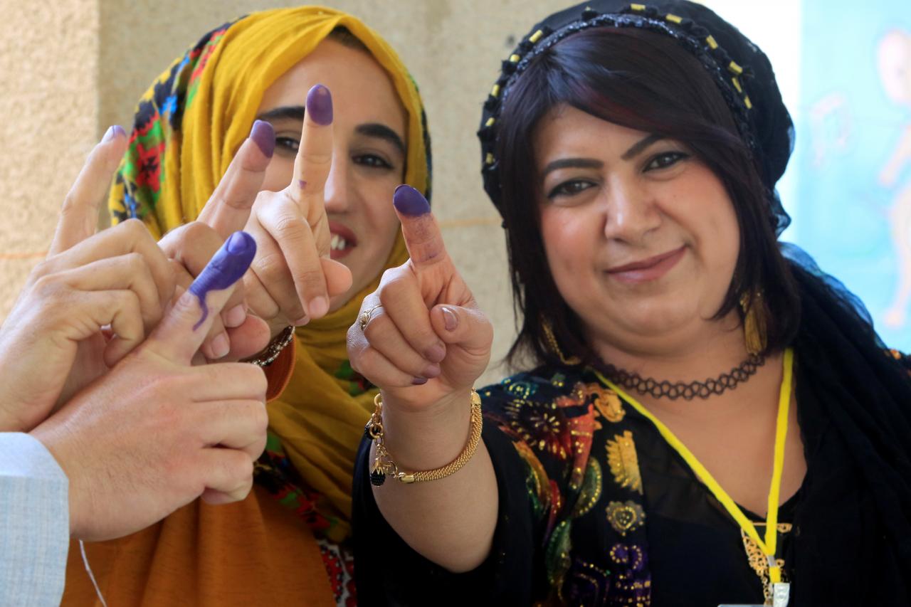 employees show their ink stained fingers during the kurd independence referendum in halabja iraq photo reuters