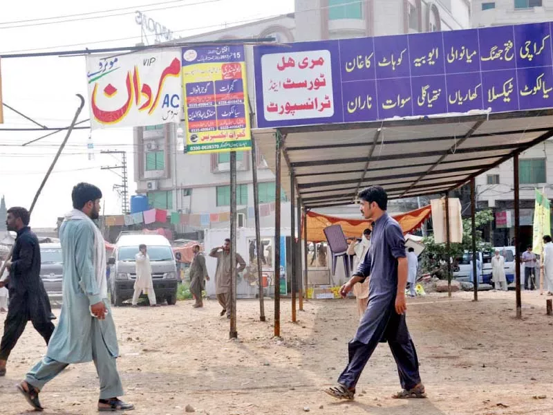 cda workers remove hoardings at a bus terminal in faizabad photo online cda workers remove hoardings at a bus terminal in faizabad photo online