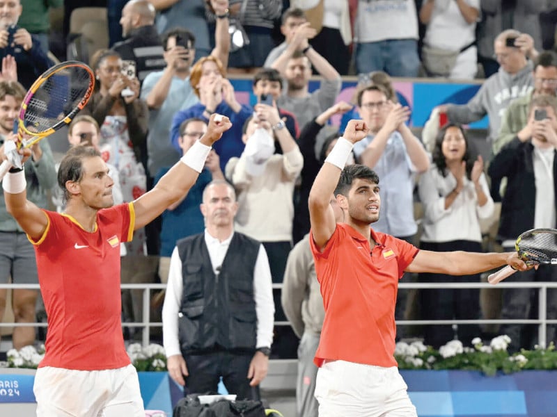 rafael nadal and carlos alcaraz celebrate after beating argentina s maximo gonzalez and andres molteni photo afp