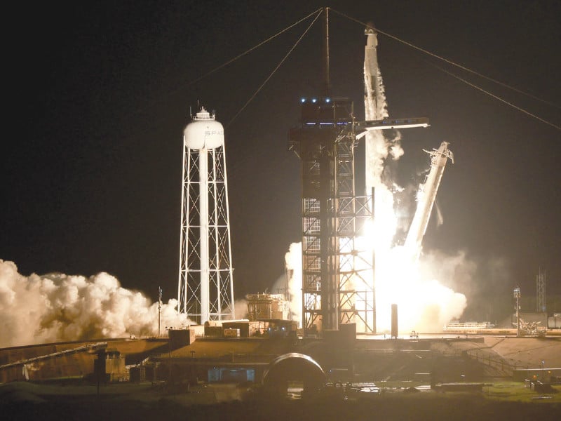 a spacex falcon 9 rocket with the crew dragon resilience capsule lifts off from launch complex 39a at kennedy space center in cape canaveral florida photo afp