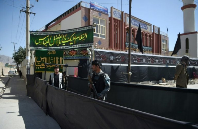 an afghan policeman stands guard outside of the baqir ul uloom mosque ahead of ashura in kabul photo afp an afghan policeman stands guard outside of the baqir ul uloom mosque ahead of ashura in kabul photo afp