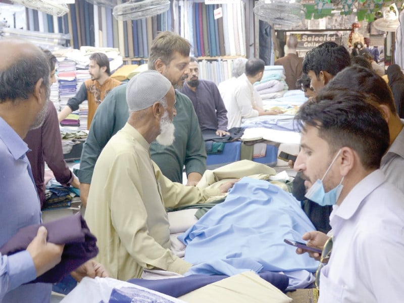 the countdown to eid is on fabric shopping nears its end as tailors stop booking orders around mid ramazan people scramble for those last minute outfits and accessories to make their eid celebrations unforgettable photo express